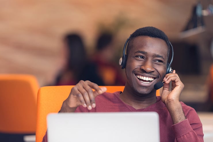 Customer service representative helping a client on a call